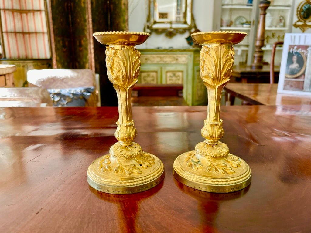 A rare pair of Louis XV gilt bronze candlesticks signed P. Gouthiere - Helen Storey Antiques