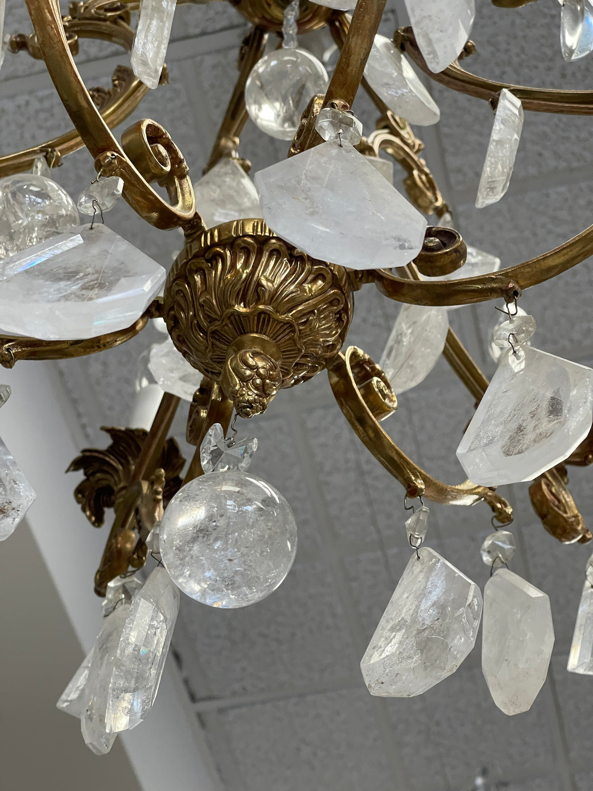 Small French Louis XV style gilt bronze and rock crystal eight light chandelier