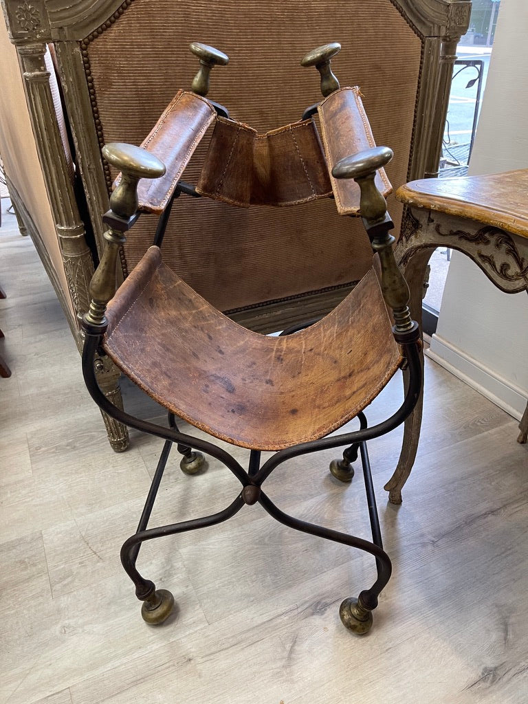 19th Century Italian iron, bronze, and leather Savonarola chair.